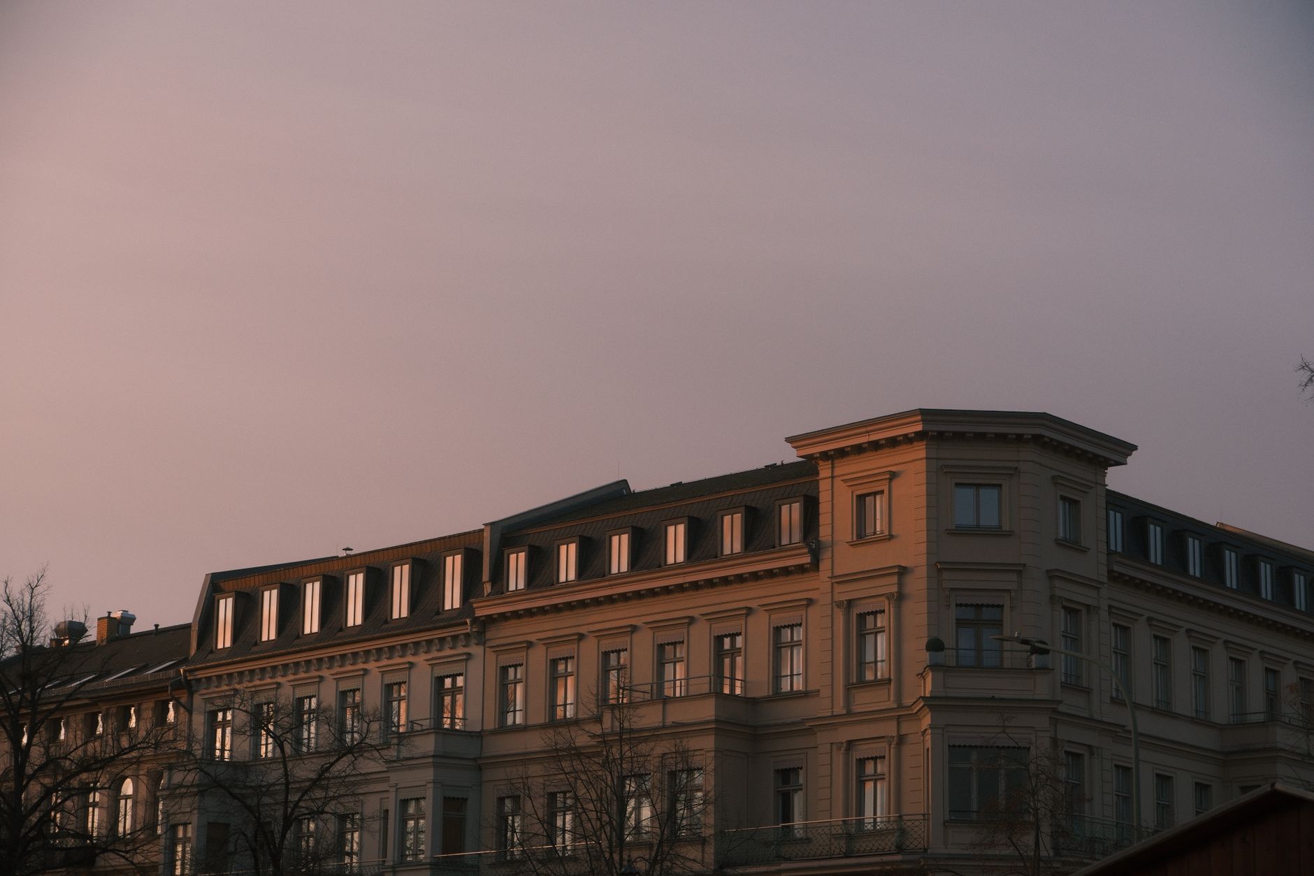 An elegant period apartment building at dusk